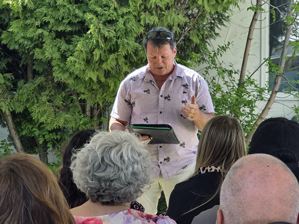 Greg addressing crowd